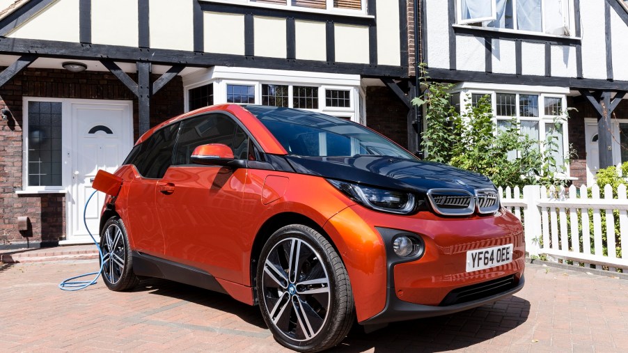 The BMW i3 REx, here in orange and black, is a plug-in hybrid with advantages over other vehicles.