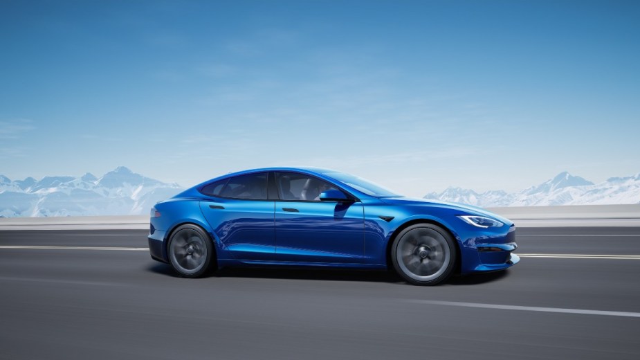 a blue tesla model s, a sporty electric sedan that offers all wheel drive