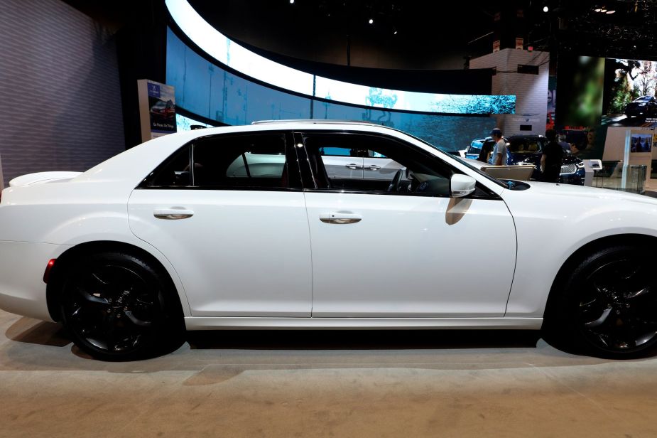 A white Chrysler 300 parked indoors, not the worst large car. 