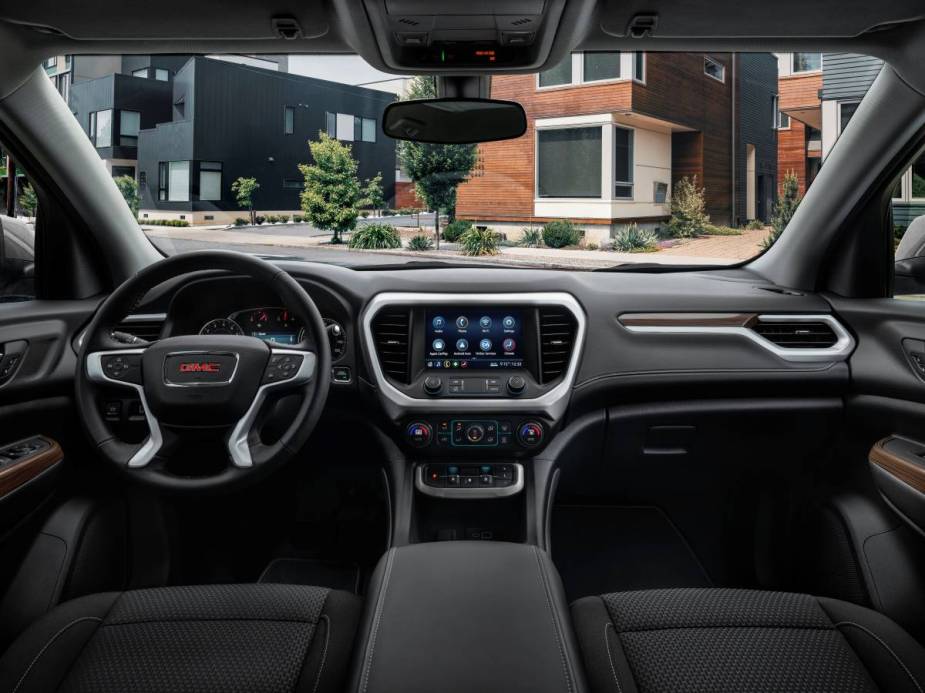 Dashboard and front seats in 2023 GMC Acadia, highlighting its release date and price