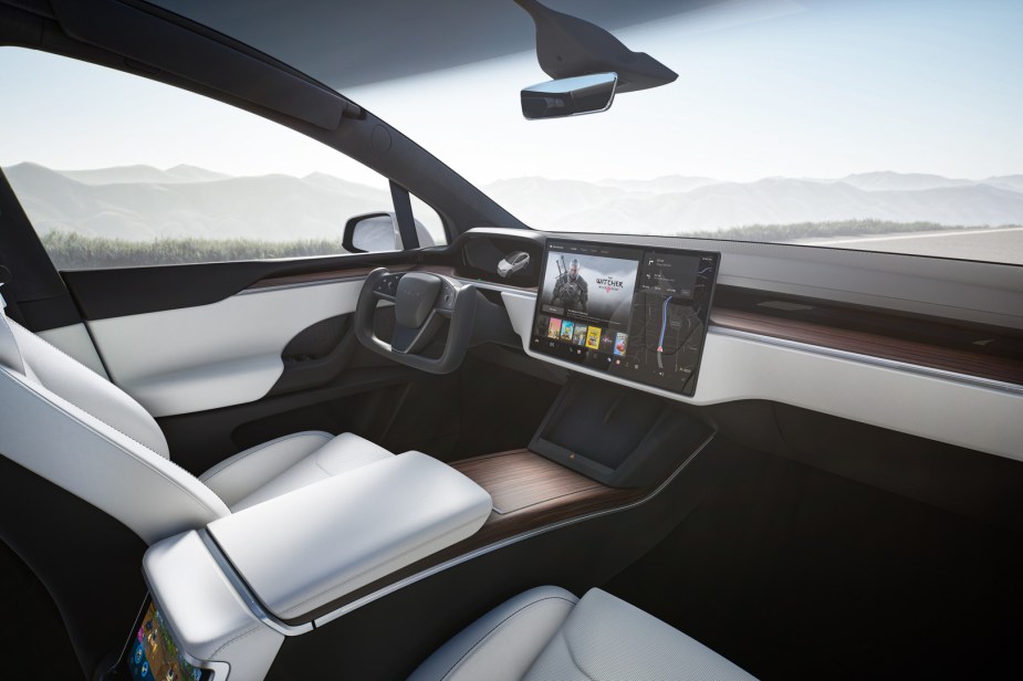 Dashboard and front seats in 2023 Tesla Model X, highlighting its release date and price