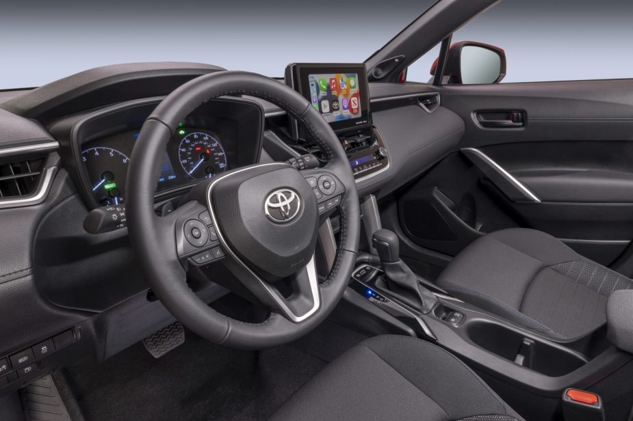 Dashboard and front seats in 2023 Toyota Corolla Cross, highlighting its release date and price