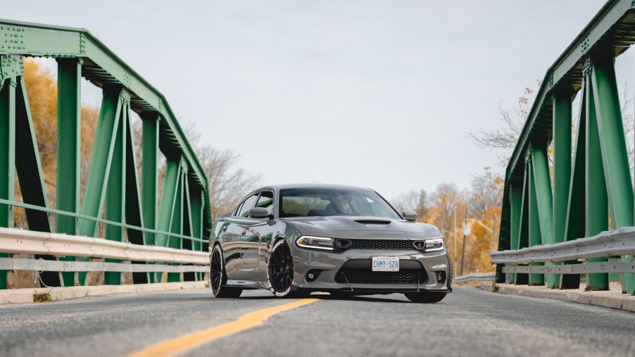 A Dodge Charger poses on a bridge