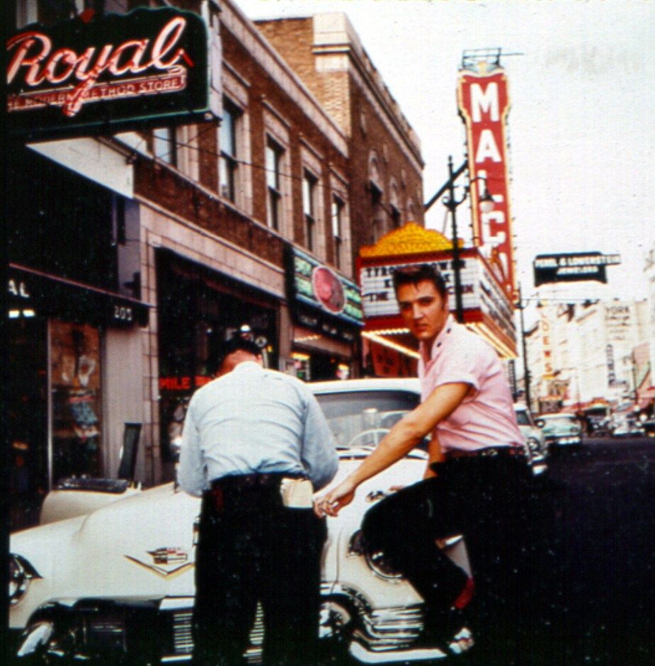 Elvis gets a ticket in a Cadillac, like his brilliantly pink Cadillac Fleetwood