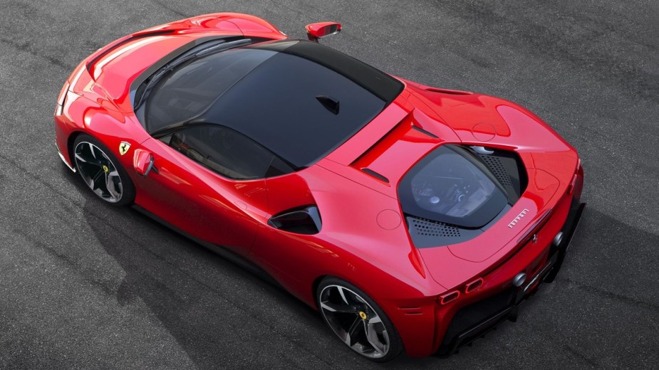 a ferrari sf90 stradale, the first ferrari to experiment to utilize plug in hybrid technology
