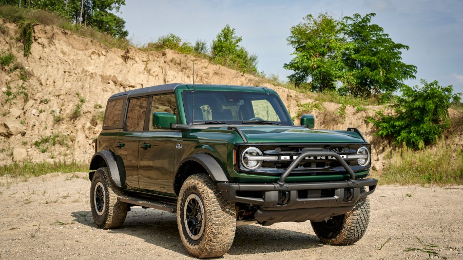 A green 2022 Ford Bronco, potentially with the Sasquatch package, parked outdoors.