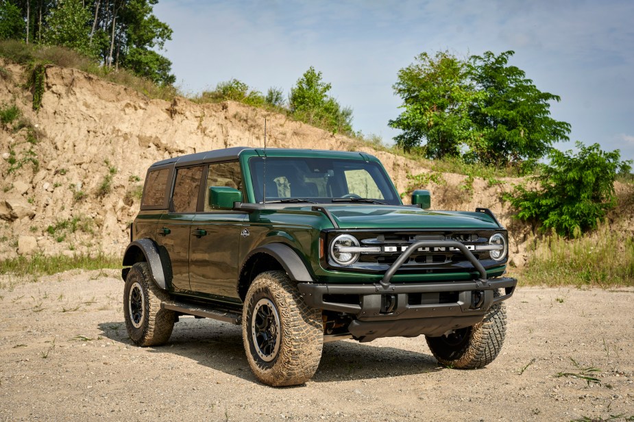 A green 2022 Ford Bronco, potentially with the Sasquatch package, parked outdoors.