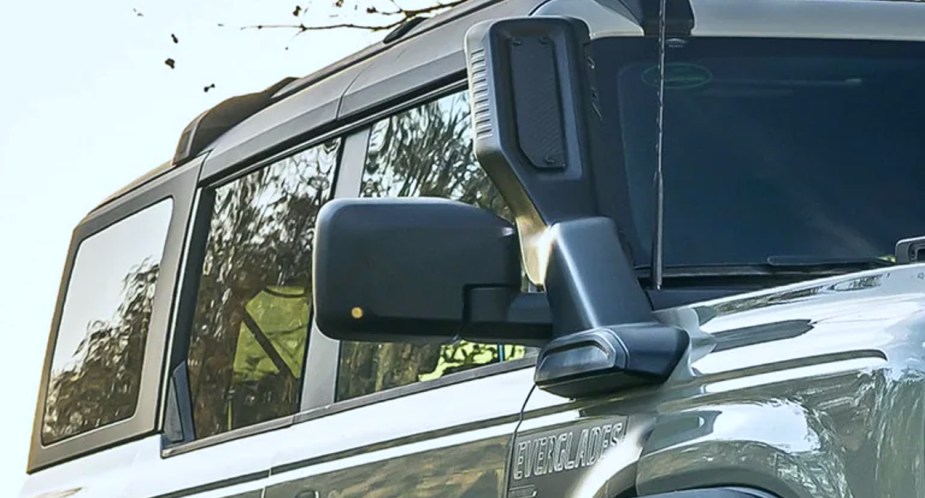 A factory-installed snorkel is attached to a green 2022 Ford Bronco Everglades off-road SUV. 