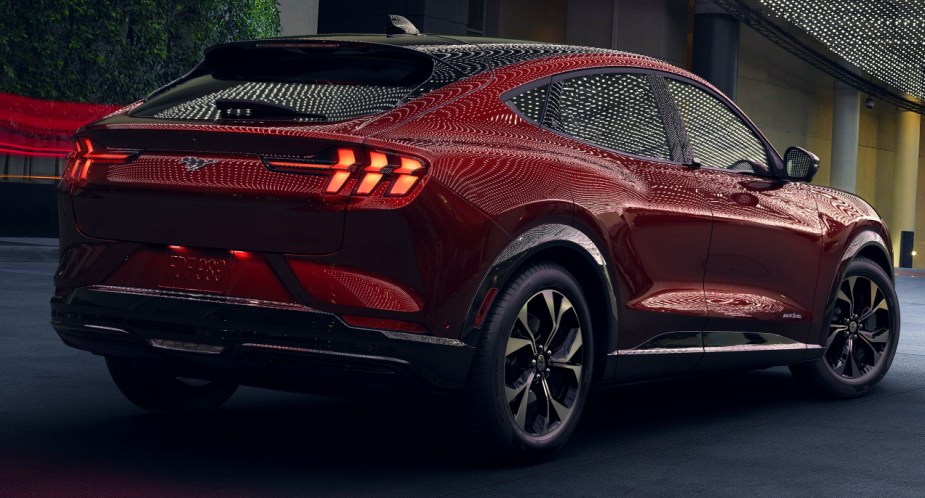 The rear of a red Ford Mustang Mac-E electric SUV. 