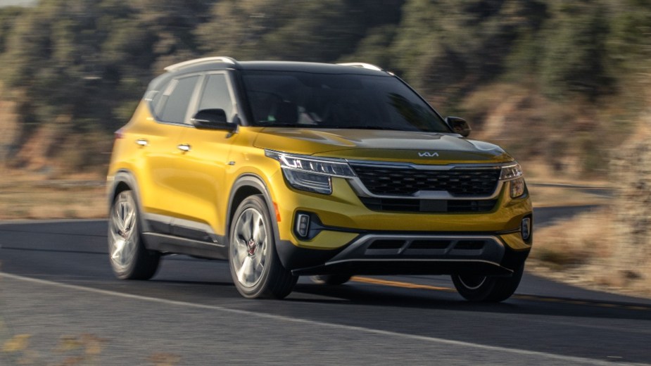 Front angle view of Starbright Yellow 2023 Kia Seltos, highlighting its release date and price