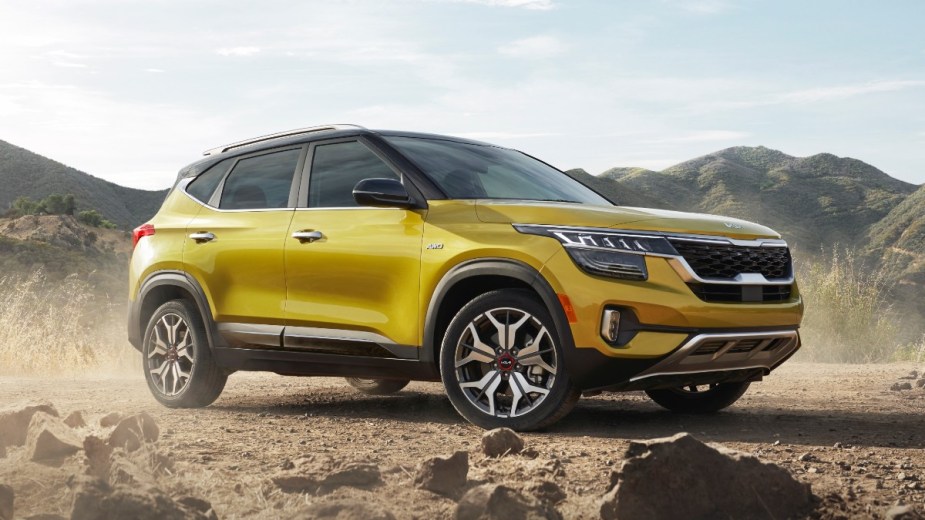 Front angle view of Starbright Yellow 2023 Kia Seltos. Consumer reports doesn't recommend the only kia subcompact SUV?