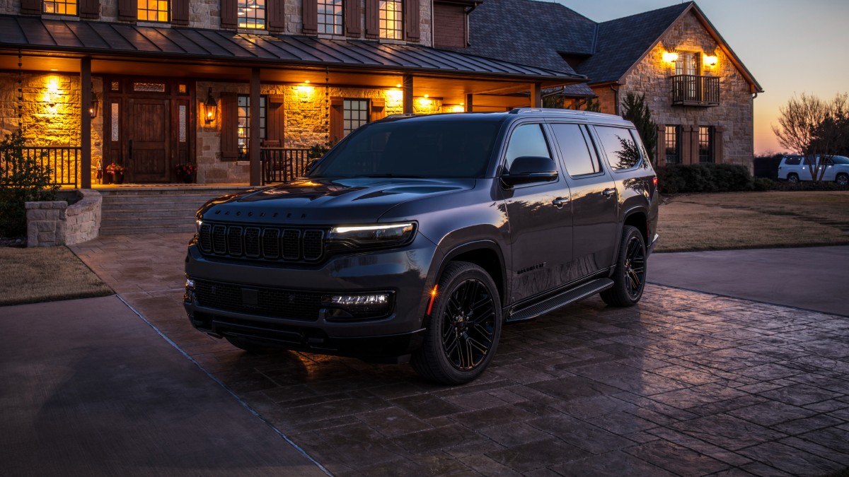 Front angle view of black 2023 Jeep Wagoneer, highlighting its release date and price