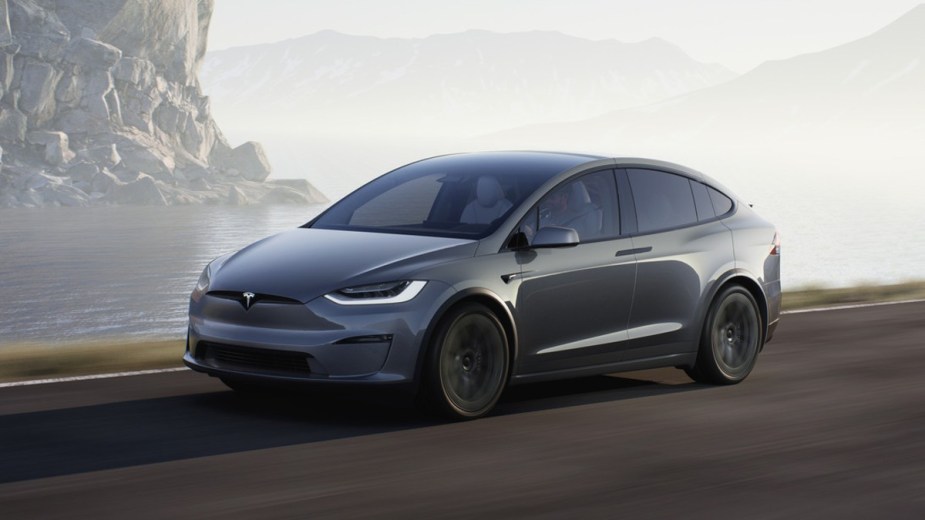 Front angle view of gray 2023 Tesla Model X, highlighting its release date and price