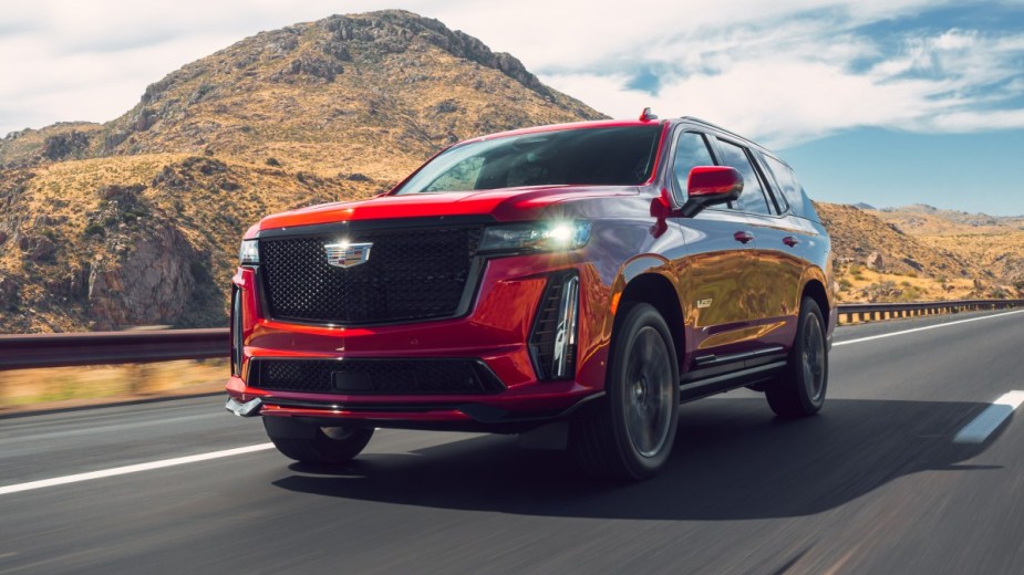 Front angle view of red 2023 Cadillac Escalade, highlighting its release date and price