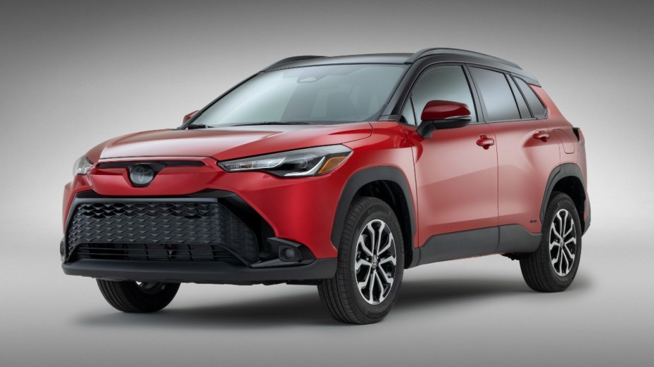 Front angle view of red 2023 Toyota Corolla Cross, highlighting its release date and price