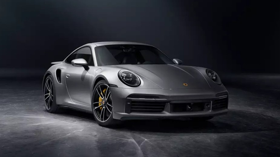 Front view of the silver 2022 Porsche 911, one of the few luxury cars that still offers a manual transmission
