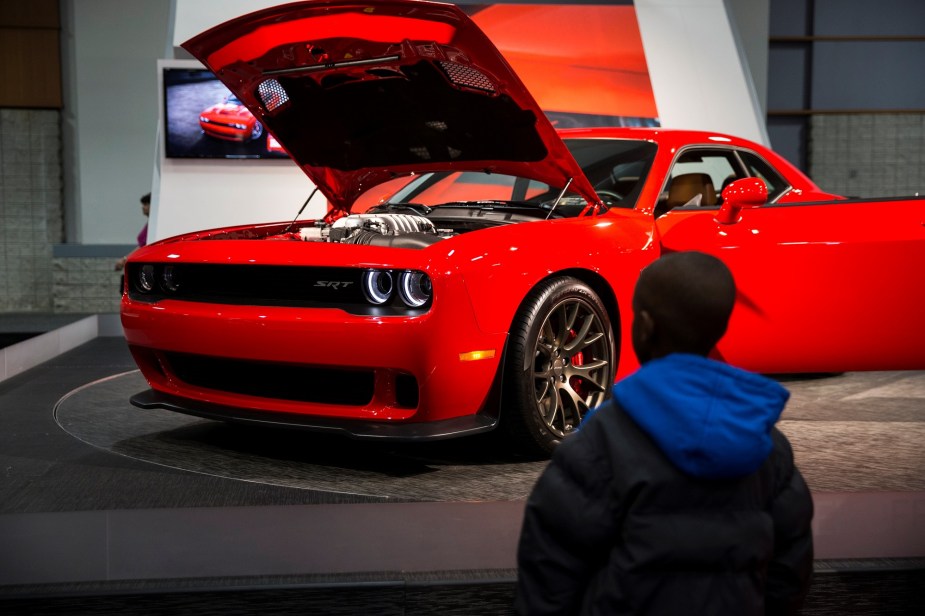 The 2015 Dodge Challenger SRT Hellcat is a somewhat cheap fast car that will go 0-60 mph faster than 4 seconds.