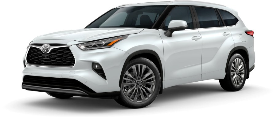 A white 2022 Toyota Highlander Platinum against a white background.