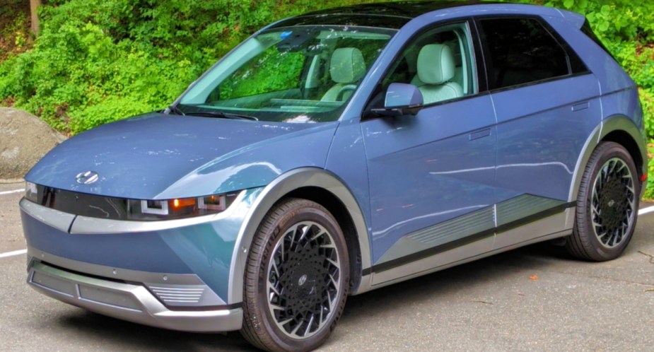 A blue 2022 Hyundai Ioniq 5 electric SUV is parked.