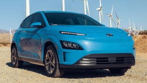 A blue 2022 Hyundai Kona Electric subcompact SUV is parked.