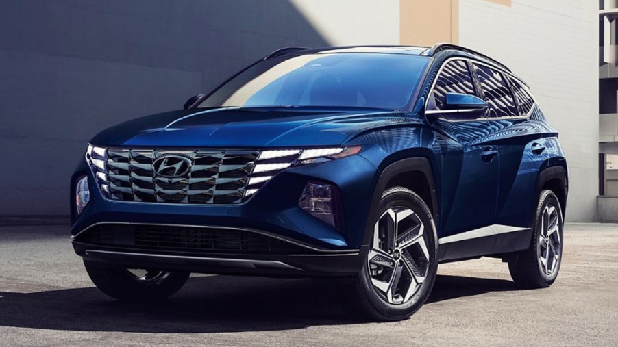 A blue 2022 Hyundai Tucson Hybrid is parked.