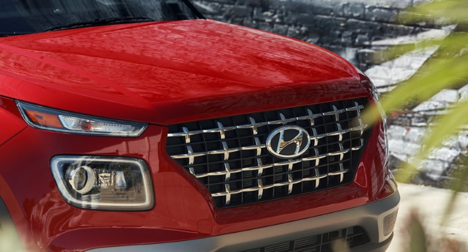 The front of a red 2022 Hyundai Venue subcompact SUV. 