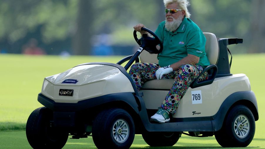 John Daly in a golf cart during the 2022 PGA Championship at the Southern Hills Country Club in Tulsa, Oklahoma