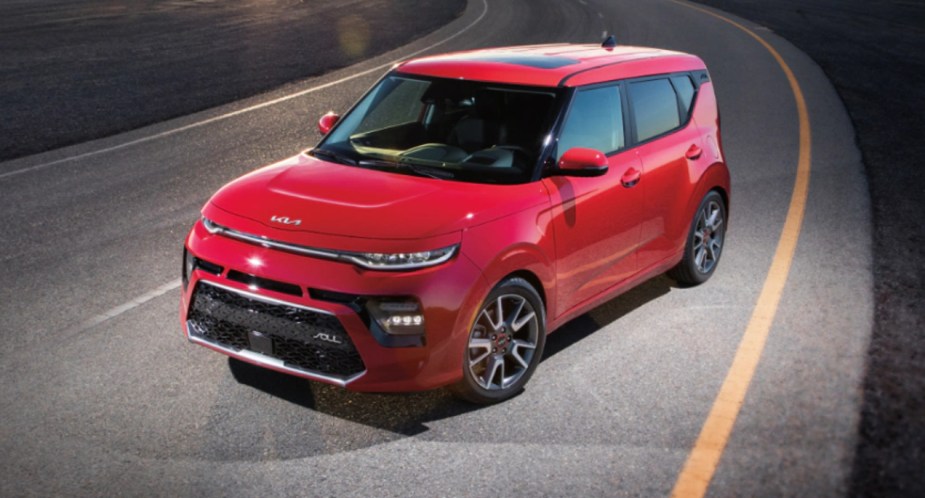 A red 2022 Kia Soul subcompact SUV is parked. 
