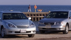 A Lexus ES 300 sitting next to an Infiniti i35