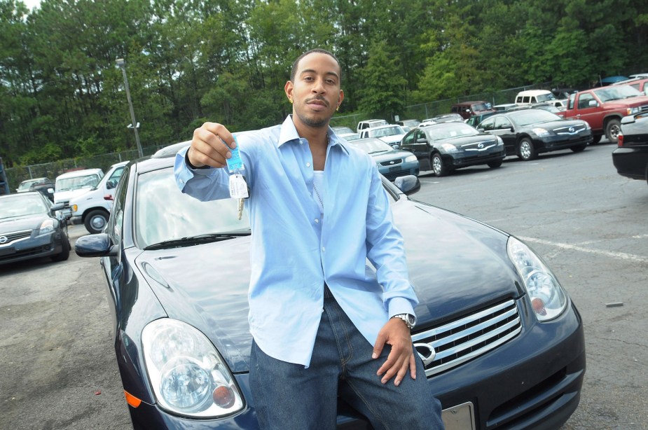 Rapper and actor Ludacris giving away an Infiniti car during a sweepstakes.