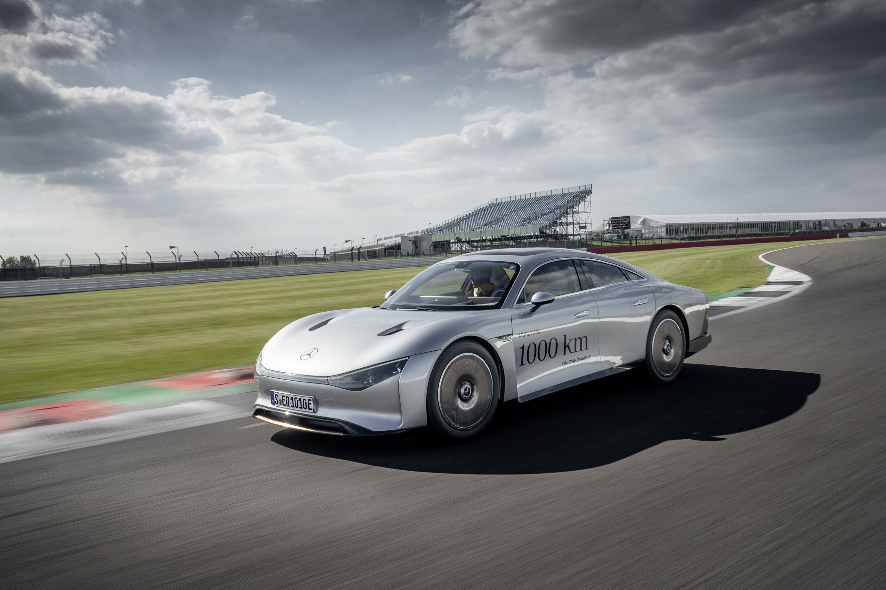 The silver Mercedes-Benz Vision EQXX Concept running laps on a racetrack