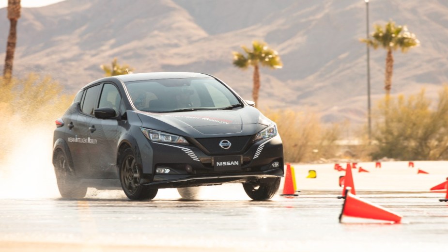 nissan e force awd working to keep traction on wet pavement of a demo course