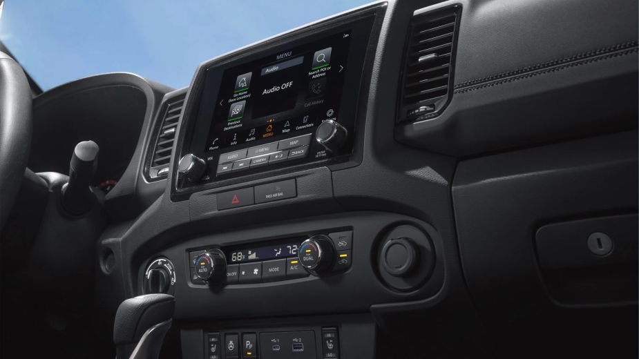 The interior of the 2022 Nissan Frontier mid-size truck, with its 9.0-inch touchscreen.