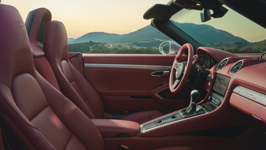 the red interior of new porsche 718 boxster, a luxurious place to spend time, despite its small size