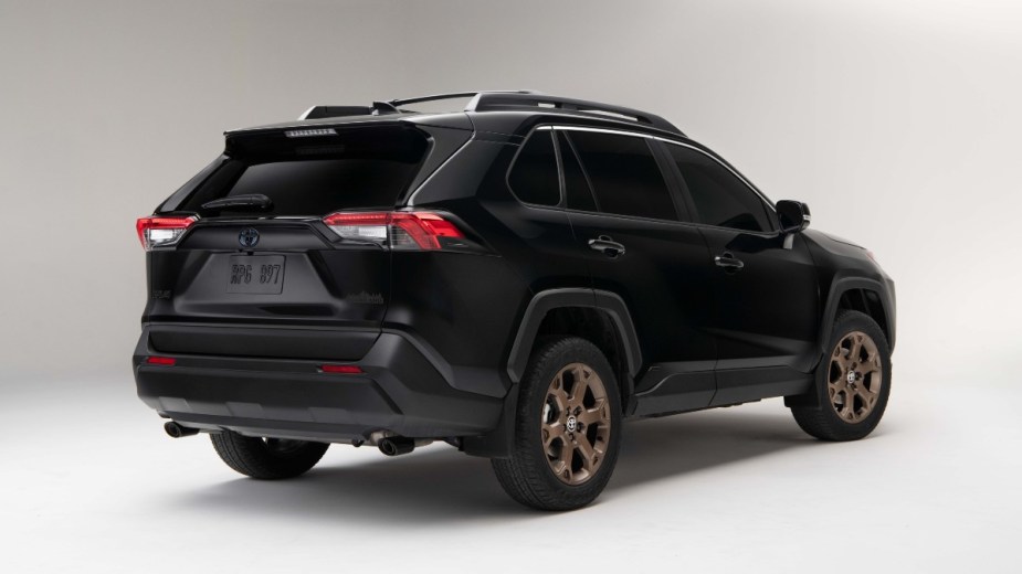 Rear angle view of black 2023 Toyota RAV4, highlighting its release date and price