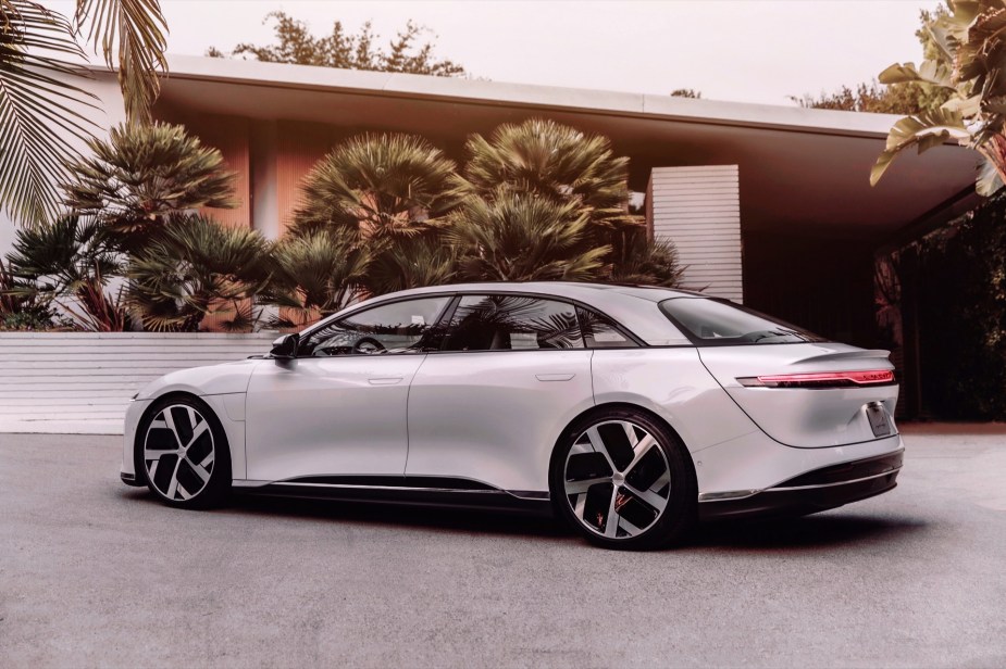 Rear angle view of white 2022 Lucid Air, the EV with the longest driving range