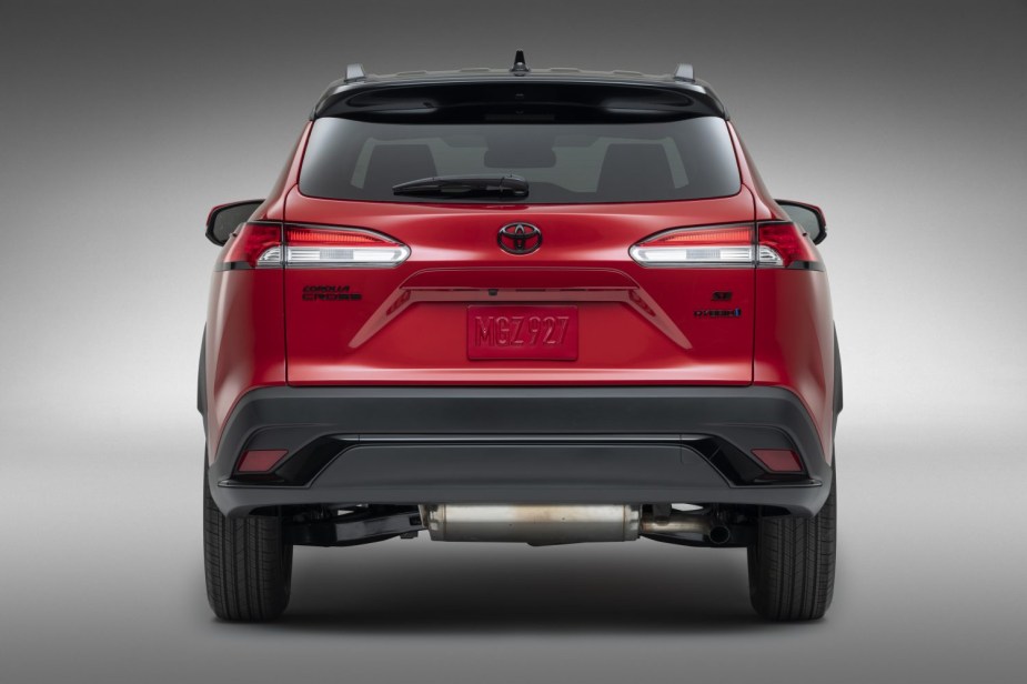 Rear view of red 2023 Toyota Corolla Cross, highlighting its release date and price