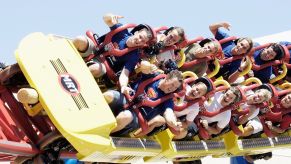 A roller coaster with people on it.