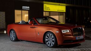 A Rolls-Royce Dawn parked outside the Design Museum in London, England