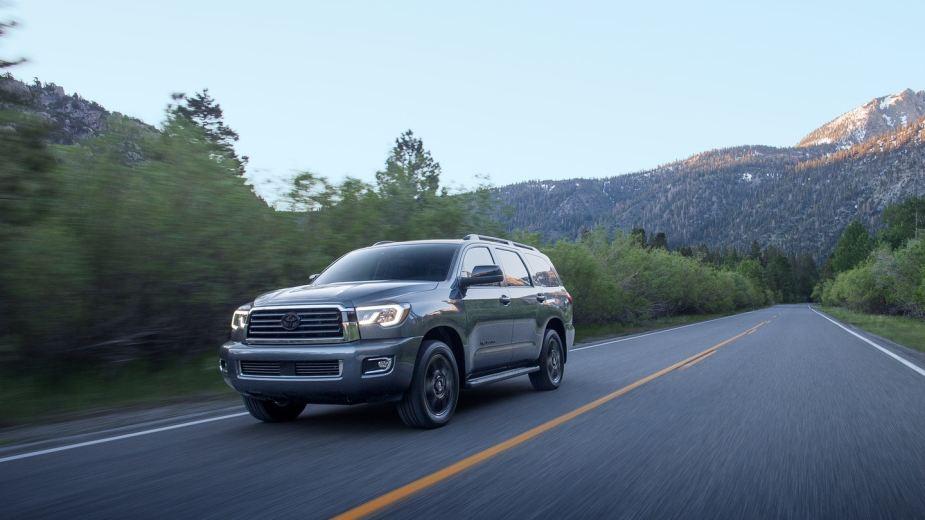 A gray 2022 Toyota Sequoia driving down a mountainous highway. COnsumer reports only recommends 2 large SUVs.