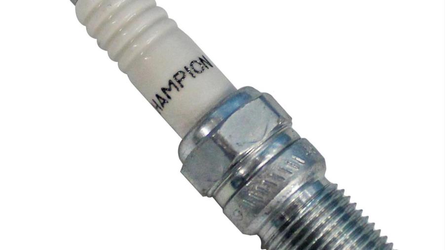 Promo photo of a Champion spark plug against a white background.
