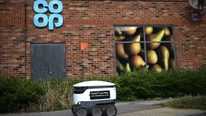 A Starship autonomous robot on its way to deliver groceries from a Co-Op supermarket in Milton Keynes, England