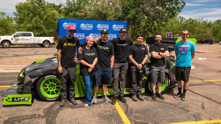 The LYFE Motorsport team posing in front of Frank 6.0
