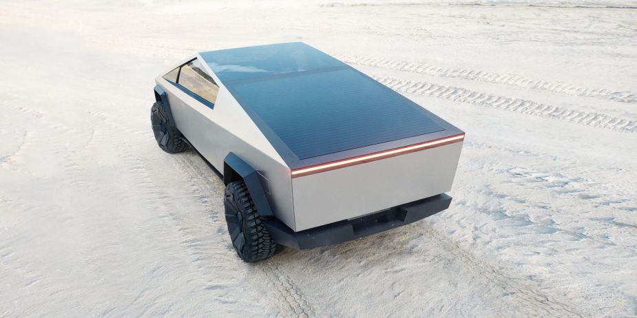 A rear shot of the Tesla Cybertruck's closed bed with the electric truck parked on a white sandy beach. It has thousands more preorders than the Chevy. 