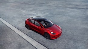 The Tesla Model 3 shows off its glass roof, which doesn't open.