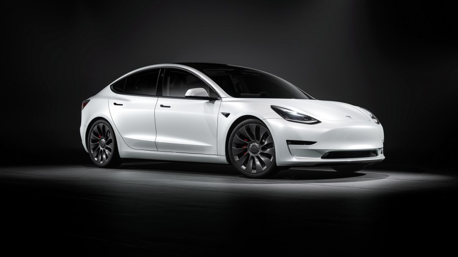 Pictured here in white, the Tesla Model 3 depreciates less than any other EV.