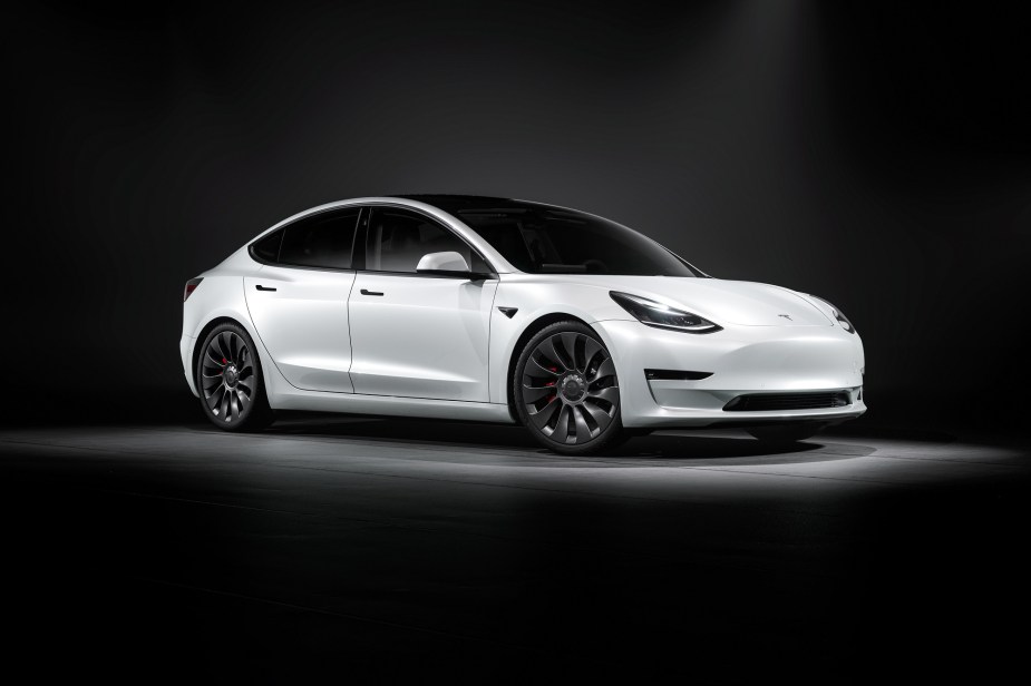 Pictured here in white, the Tesla Model 3 depreciates less than any other EV.