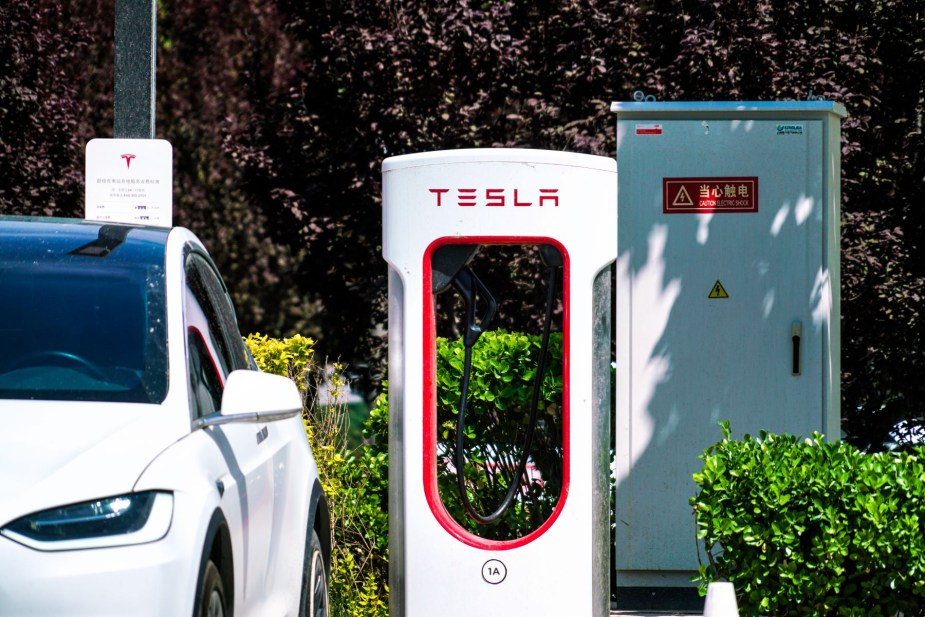 A Tesla Model 3 battery charging at a Tesla Supercharger station in Beijing, China