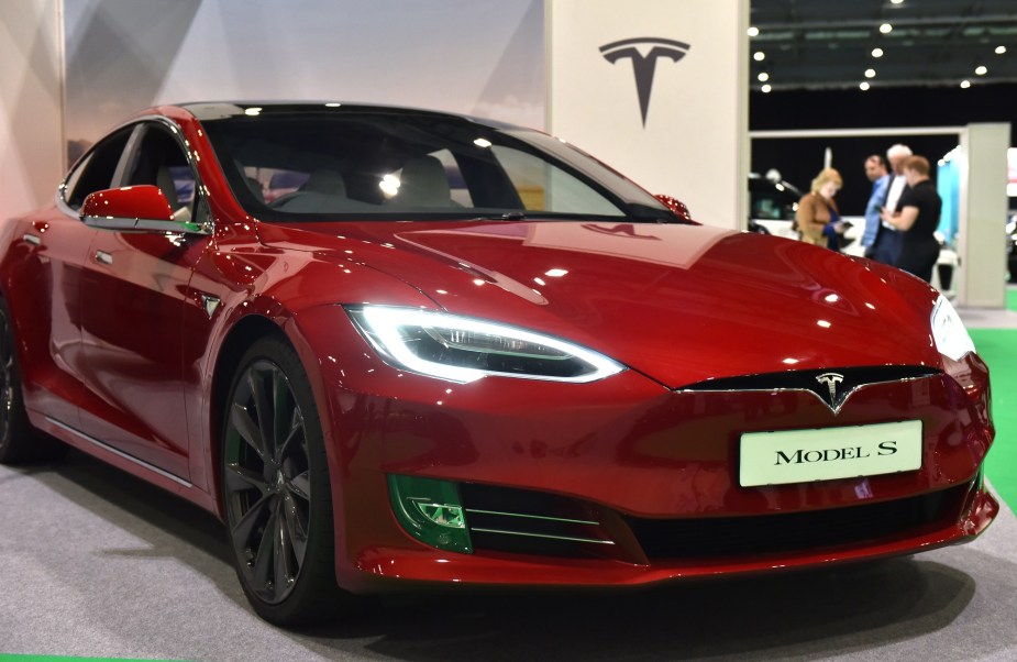 The Tesla Model S, pictured here in red, offers long range and is one of the fastest charging electric cars