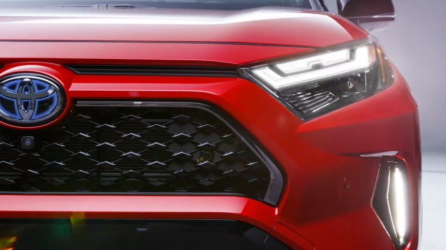 A red 2022 Toyota RAV4 Prime plug-in hybrid SUV.